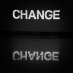a black and white photo of the word change